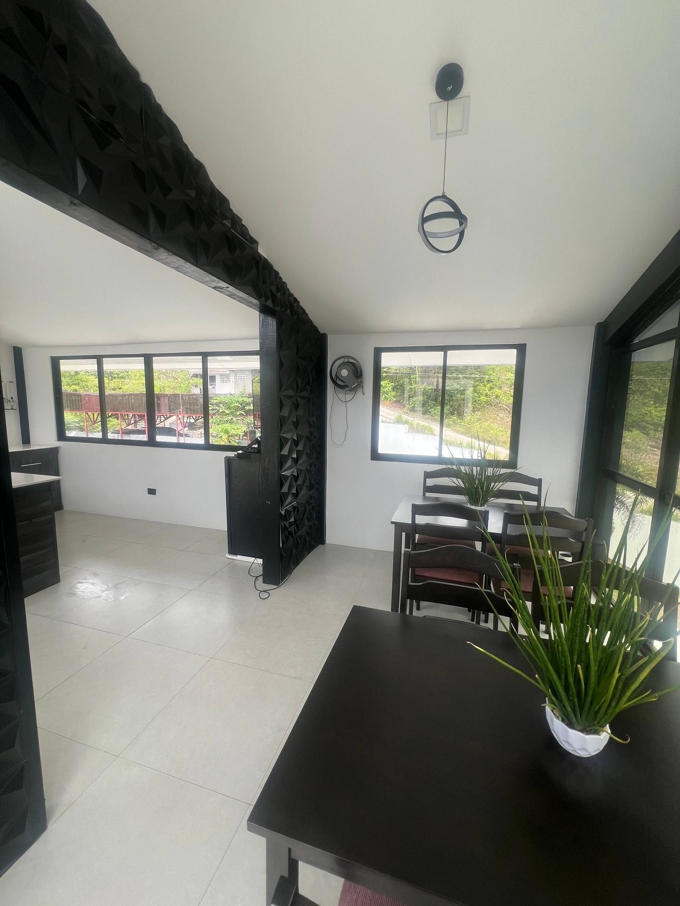 Dining and bar area with feature wall