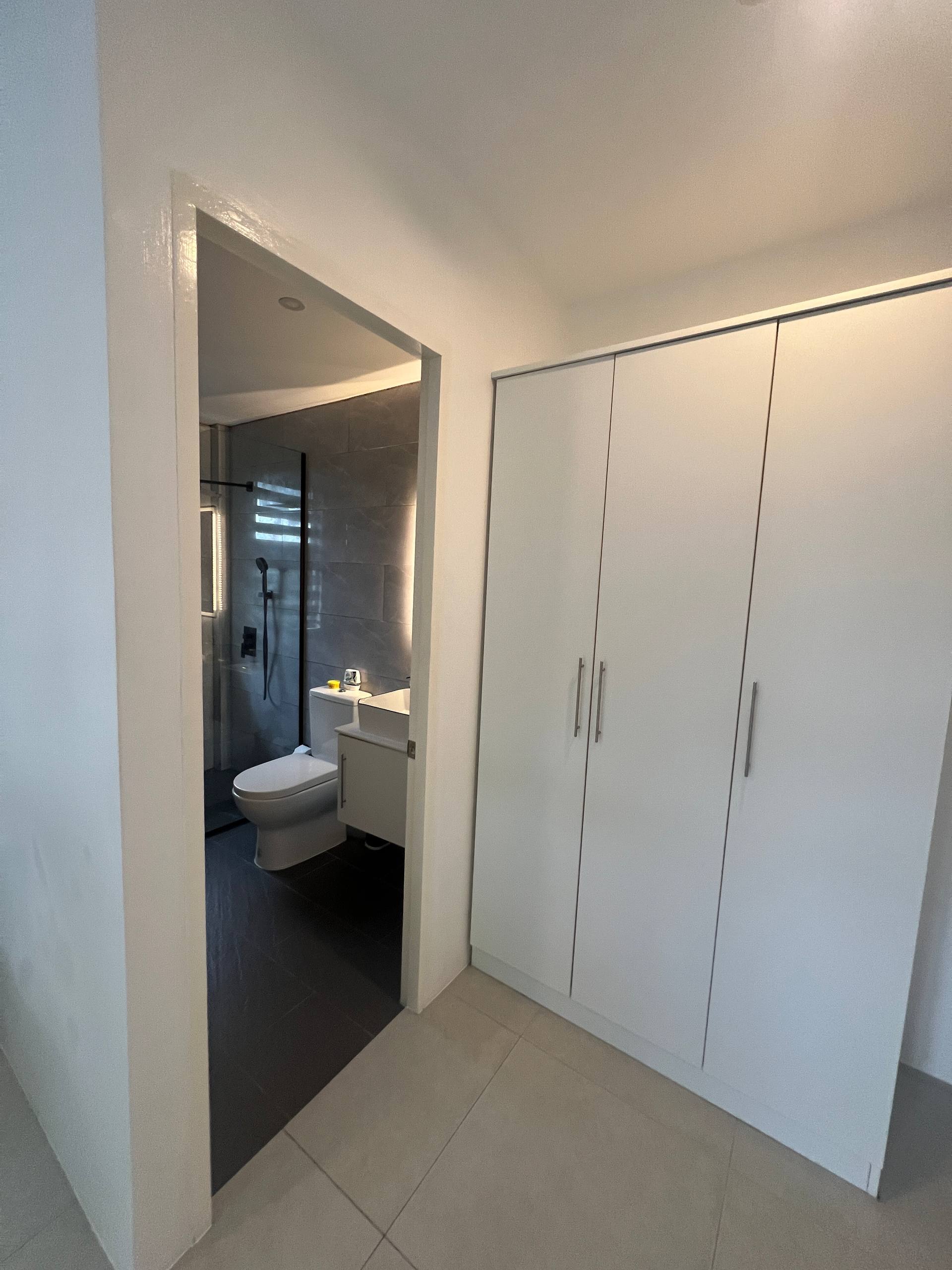 En-suite doorway view from bedroom showing shower and vanity