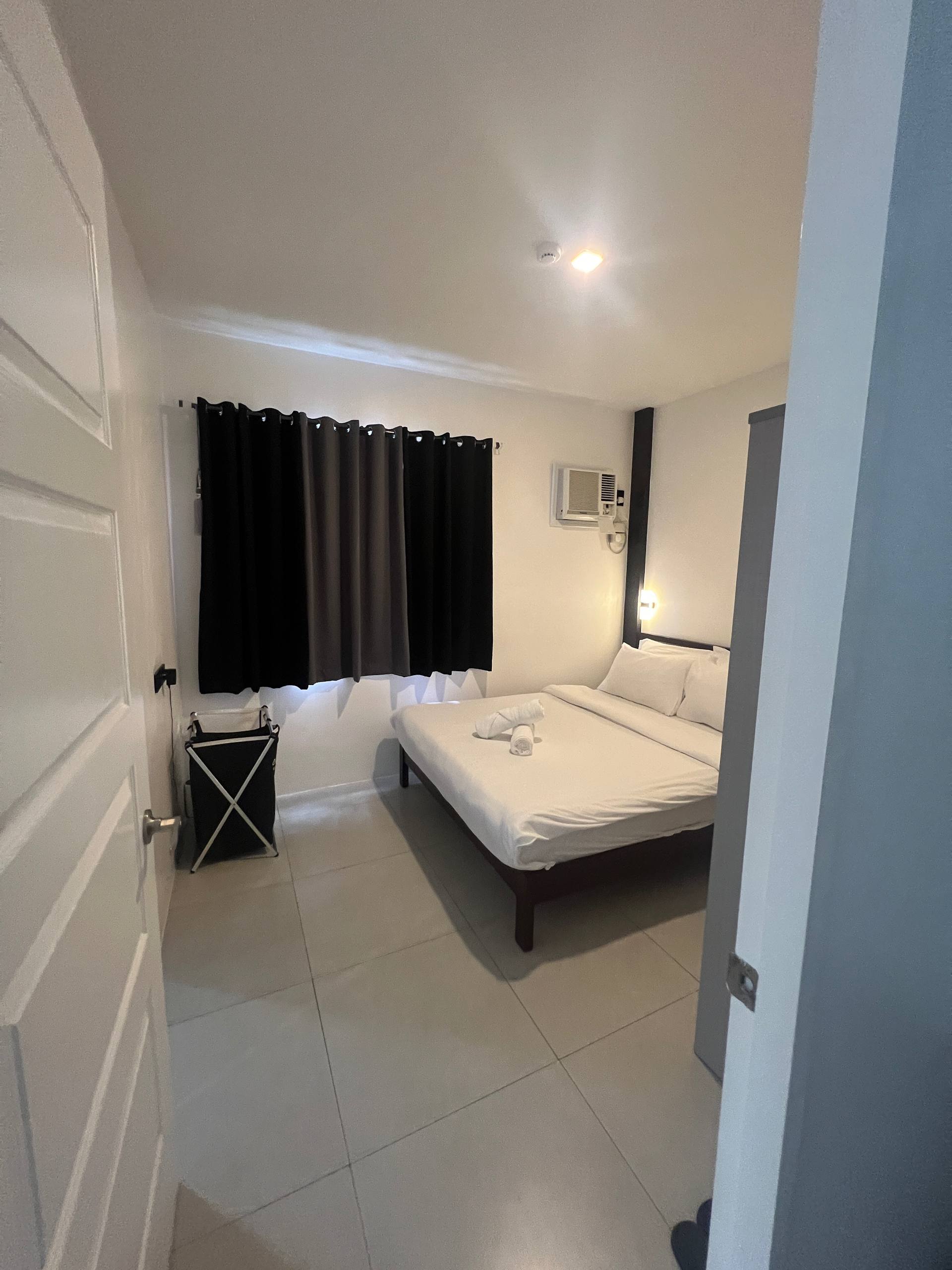 Bedroom 4 from doorway with AC and sconces