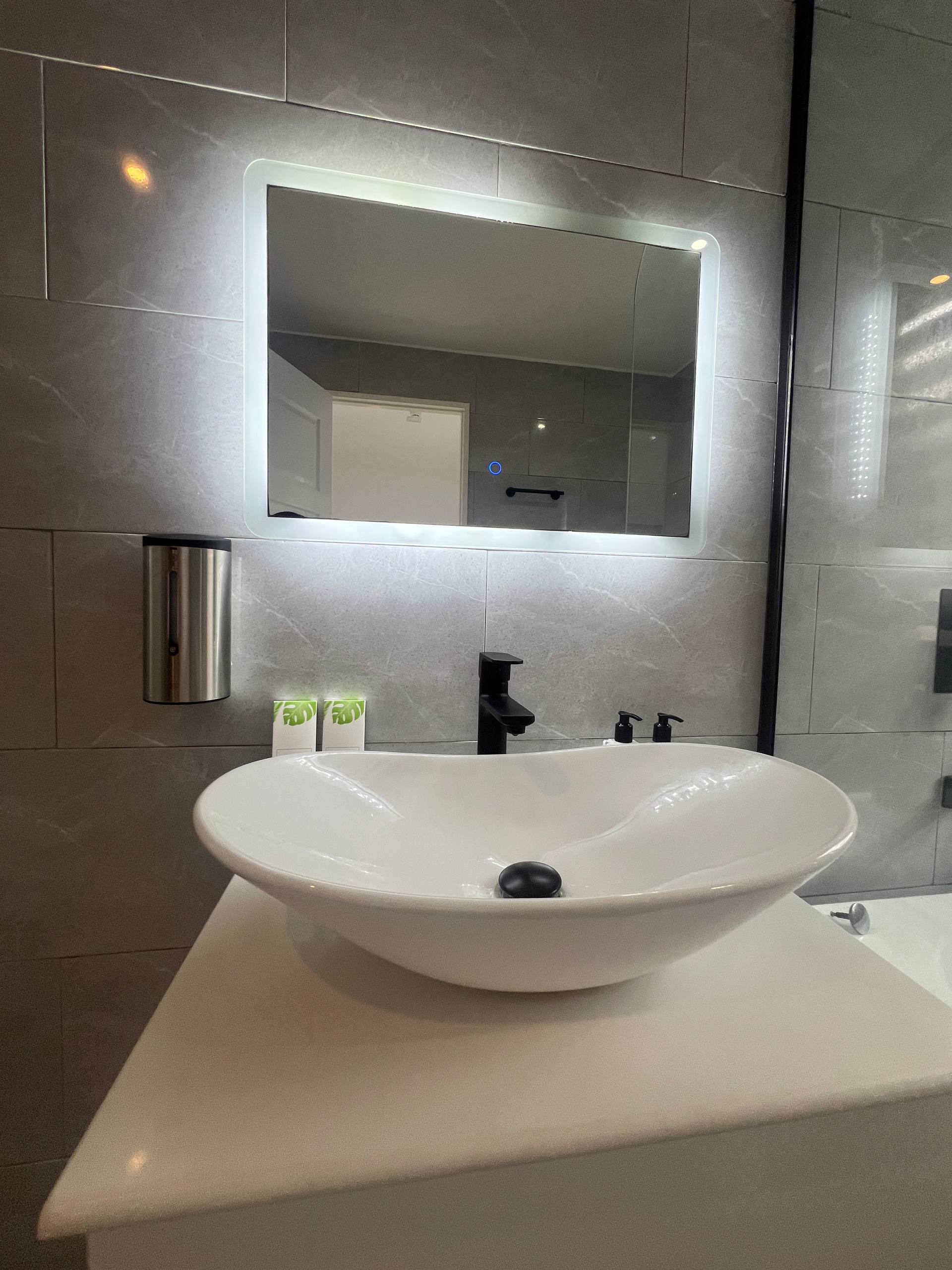 En-suite sink, mirror and faucet details