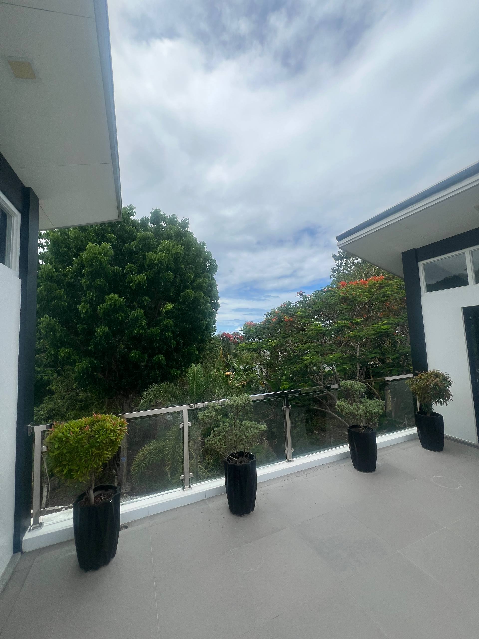 Outdoor balcony planters and glass railing